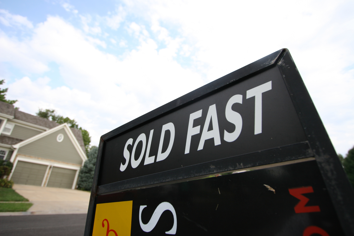 Sold Fast sign in house yard